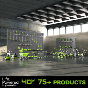 Greenworks charger beside garden tools showing ready-to-use battery benefits