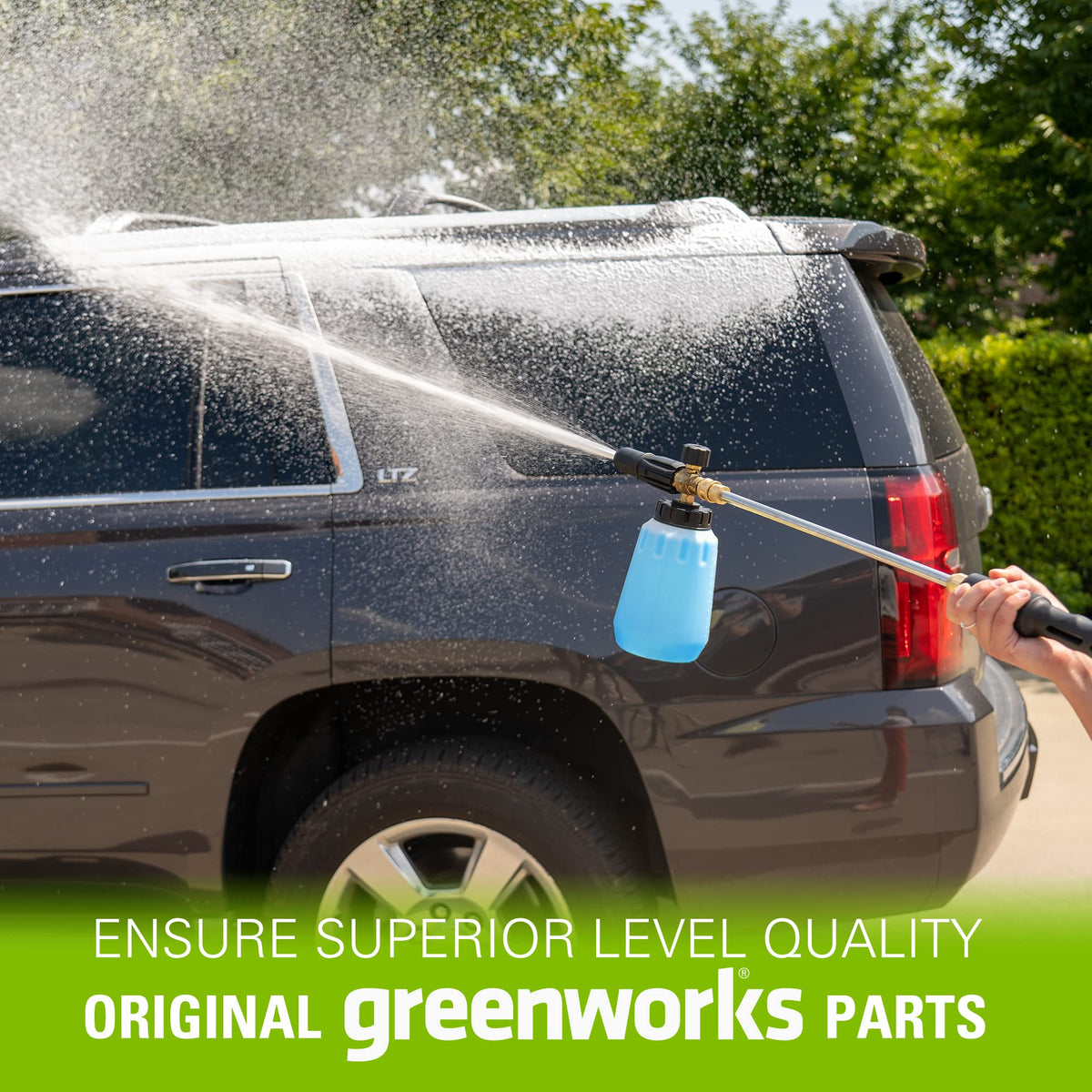 Greenworks foam cannon next to spray bottle illustrating compact scale benefit