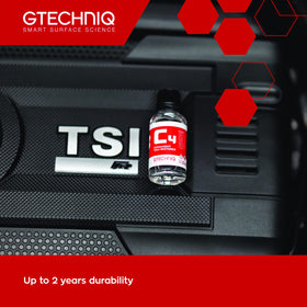 Gtechniq C4 bottle next to coin for scale, compact and concentrated
