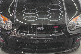 Gtechniq EXO causing water to bead on car paint showing superior water repellency benefit