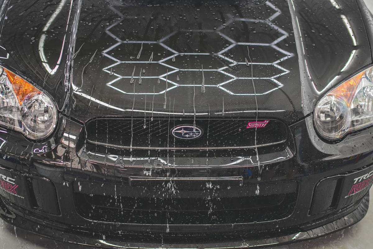 Gtechniq EXO being sprayed onto a microfiber applicator, demonstrates simple single-layer use benefit