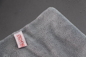 Gtechniq MF1 edge and stitch detail highlighting durable construction and lint-free use