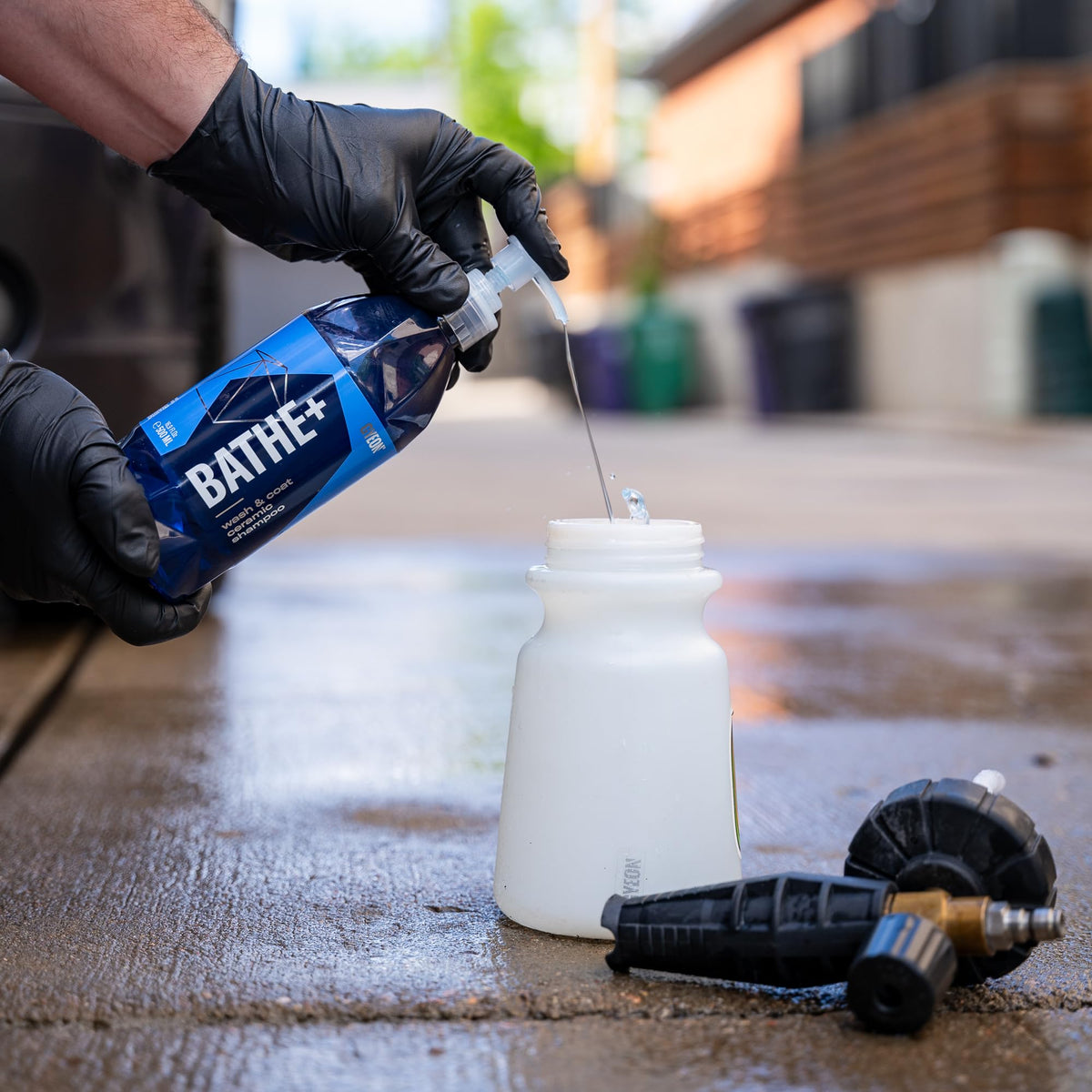 Gyeon Bathe+ pouring into bucket illustrating correct dilution and efficiency
