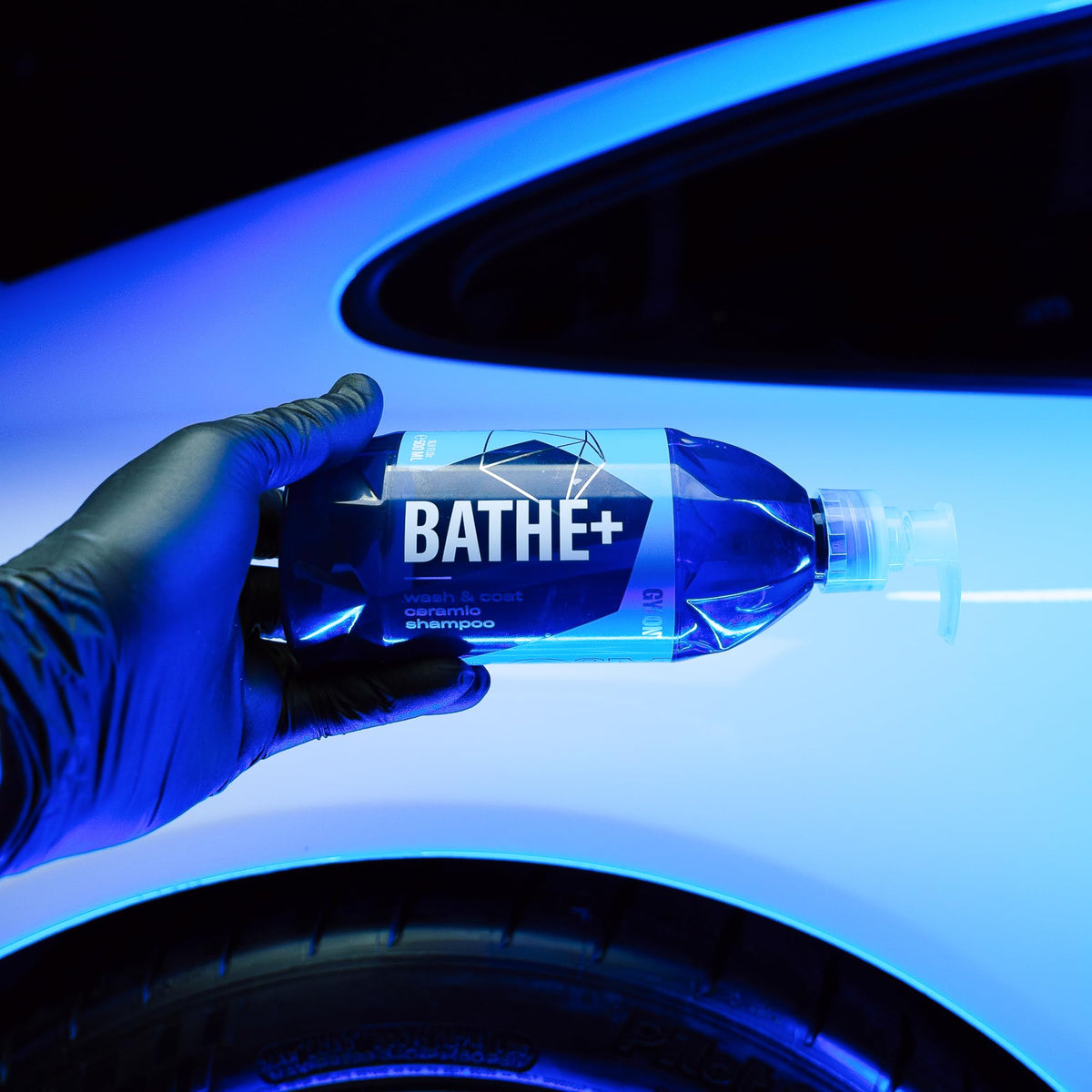 Gyeon Bathe+ bottle next to hand showing 1000ml size and ergonomic design
