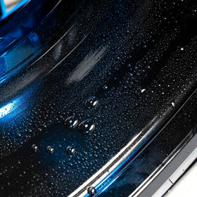 Gyeon hydrophobic beading on rim illustrating water‑shedding and easier washing benefit
