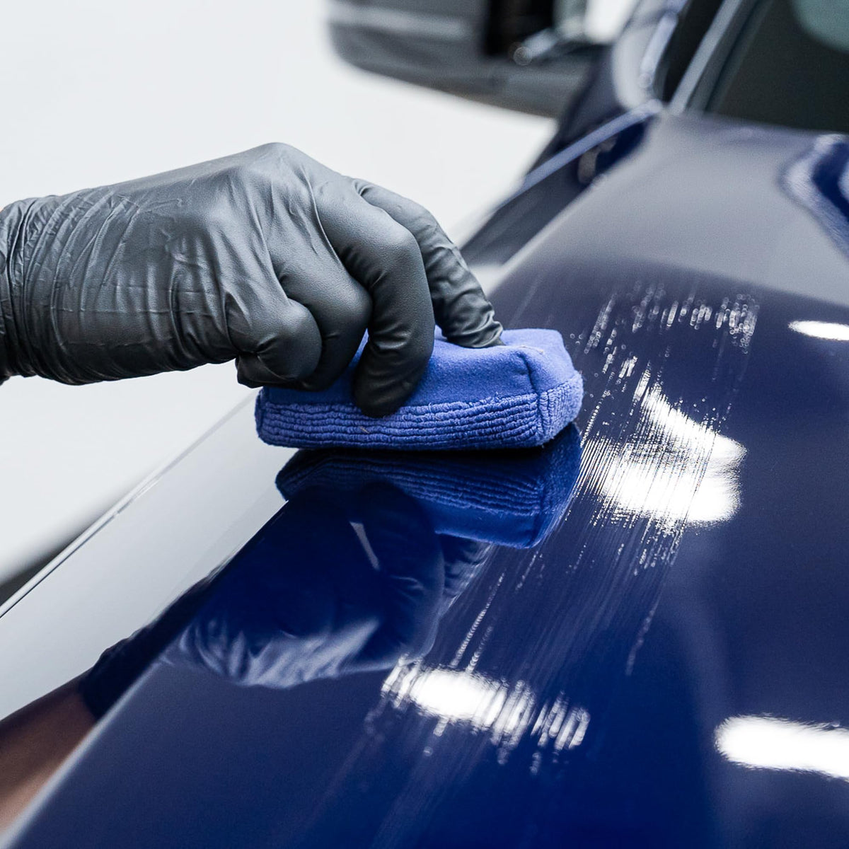 Gyeon MOHS gloss reflection detail on car paint showcasing mirror-like shine