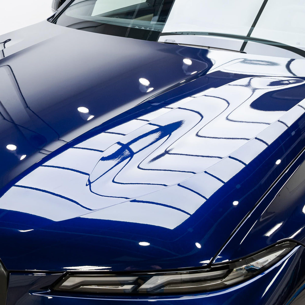 Gyeon MOHS water beading demo on hood illustrating hydrophobic runoff benefits