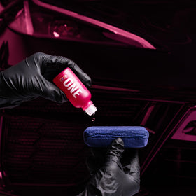 Gyeon bottle next to microfiber showing 50ml scale and efficient coverage per application