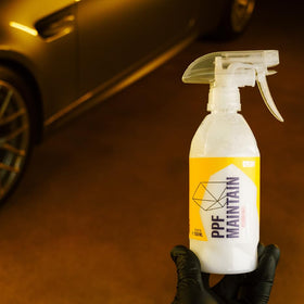 Gyeon product being spread with a microfiber towel for easy maintenance and streak-free results