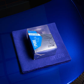Gyeon Pure glossy paint panel reflecting light to show deep candy-like gloss