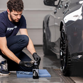 Parked car with freshly dressed tires by Gyeon boosting curb appeal