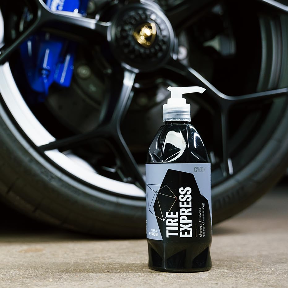 Spray application of Gyeon on a damp tire showing fast absorption benefit