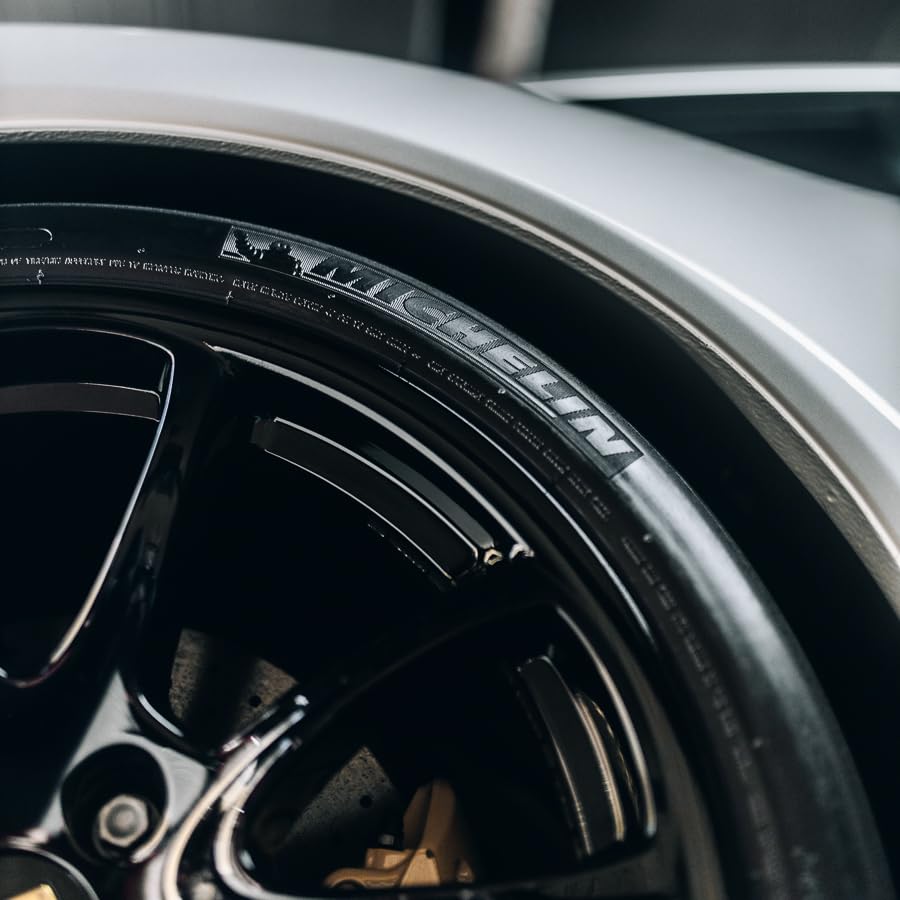 Gyeon on a parked car tire demonstrating long‑lasting satin appearance