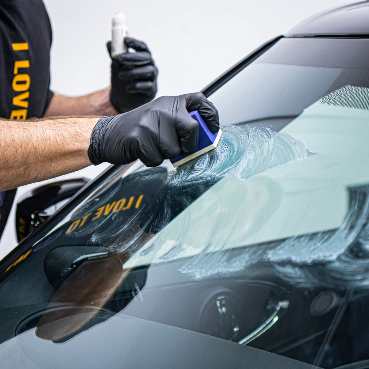 Gyeon being applied to a windshield for clearer wet-weather vision