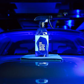 Gyeon bottle next to microfiber for scale and quick-application benefit