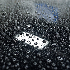 Gyeon Wet Coat being sprayed on a wet car panel to speed up rinse-off maintenance