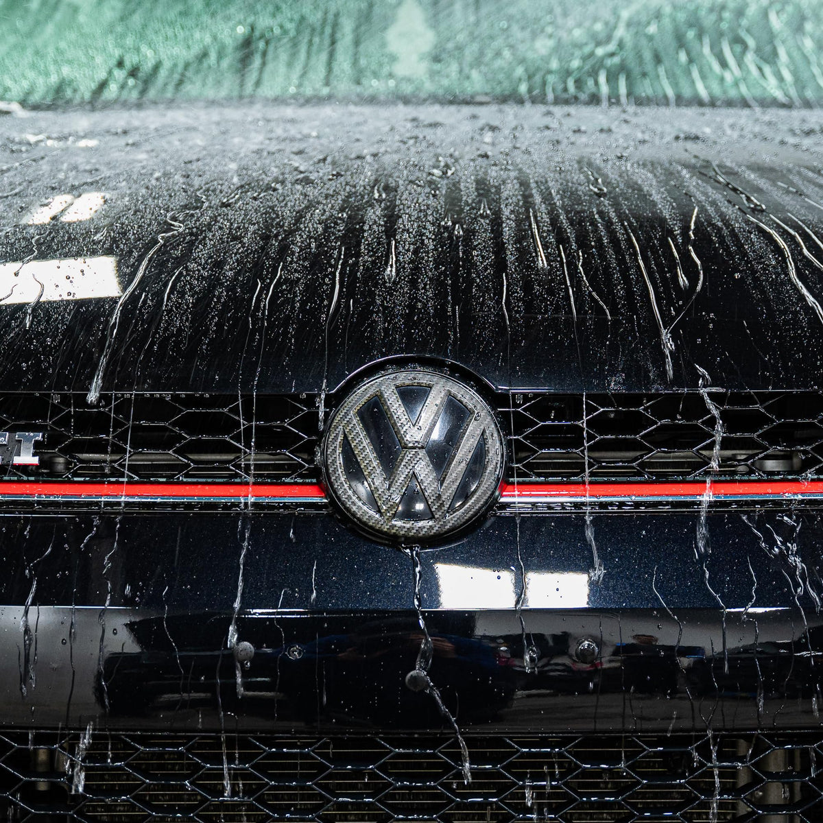 Gyeon Wet Coat on paint close-up highlighting instant gloss and improved surface reflection