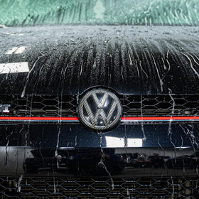 Gyeon Wet Coat on paint close-up highlighting instant gloss and improved surface reflection