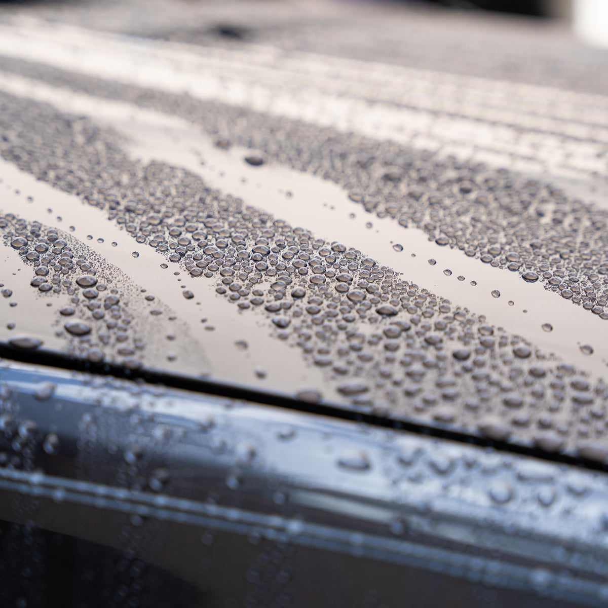 Gyeon treated wheel before and after showing cleaner runoff and gloss