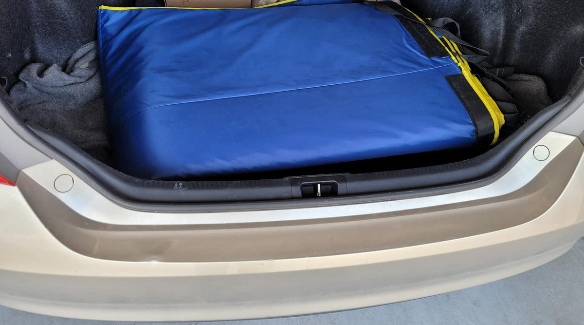 HailOut installed on a midsize sedan in a driveway showing fast setup and protection benefit