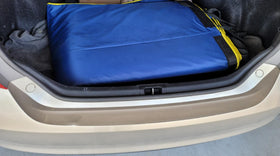 HailOut installed on a midsize sedan in a driveway showing fast setup and protection benefit