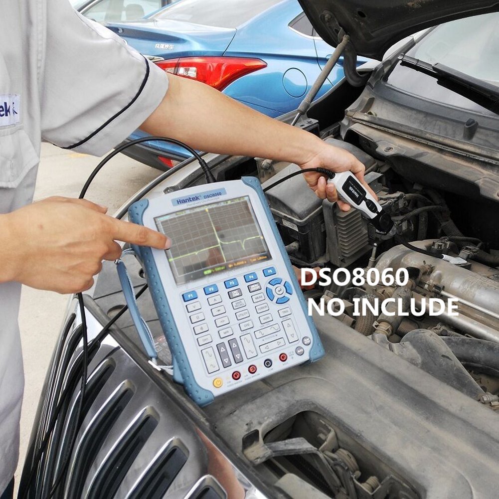 Hantek HT25COP attached to an engine coil in use demonstrating easy access in tight spaces