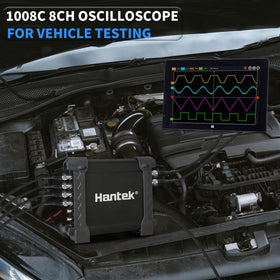 Hantek held in hand for scale showing compact form factor and portability