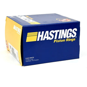 Hastings ring set installed near piston for scale, showing direct-fit compatibility