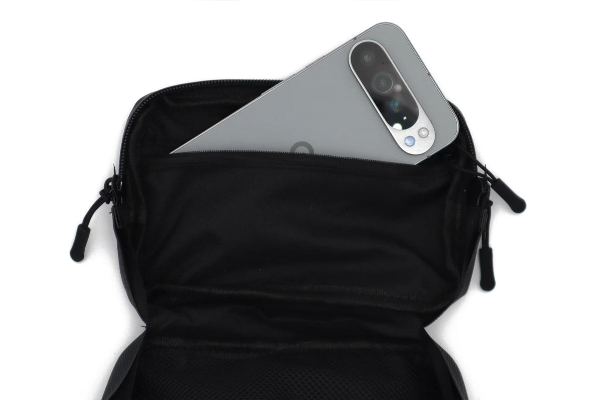 Havoc Racing bag next to phone to show 8x5x2 inch capacity and fit