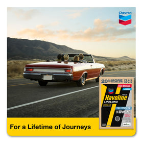 Havoline bottle next to engine bay illustrating quick lubrication benefit