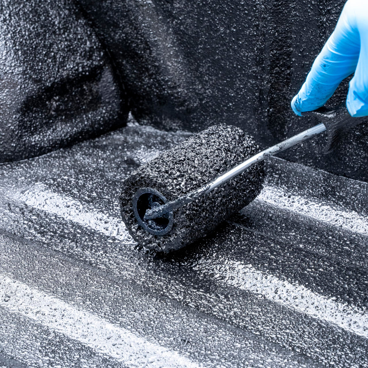 HERCULINER being rolled onto bed demonstrating easy DIY application