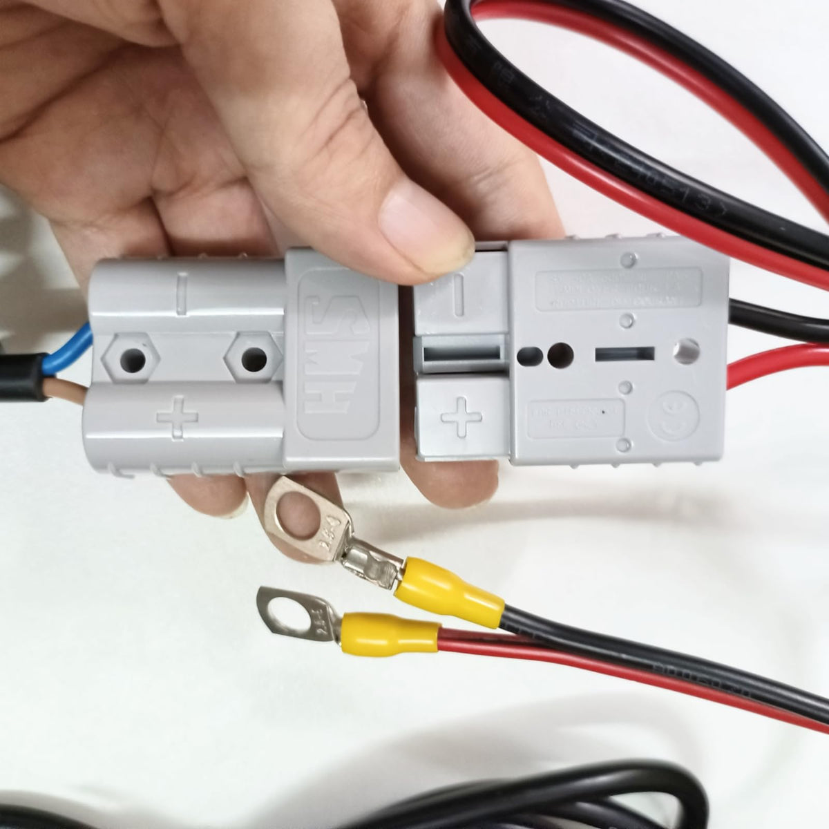 HERISKEER specification label close-up showing voltage and amp ratings