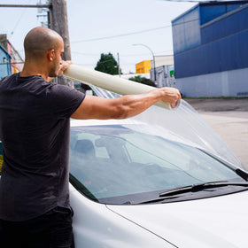 HI-TECH film covering car carpet protecting interior from dirt