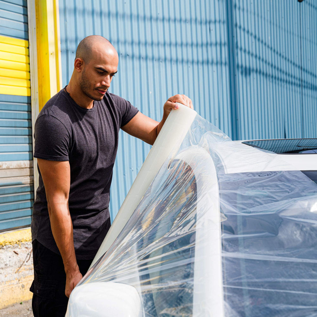 HI-TECH wrapped broken window protecting interior from weather