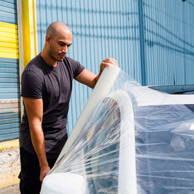 HI-TECH wrapped broken window protecting interior from weather
