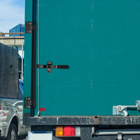 Hicarer installed on fold-down ramp door providing secure cargo protection