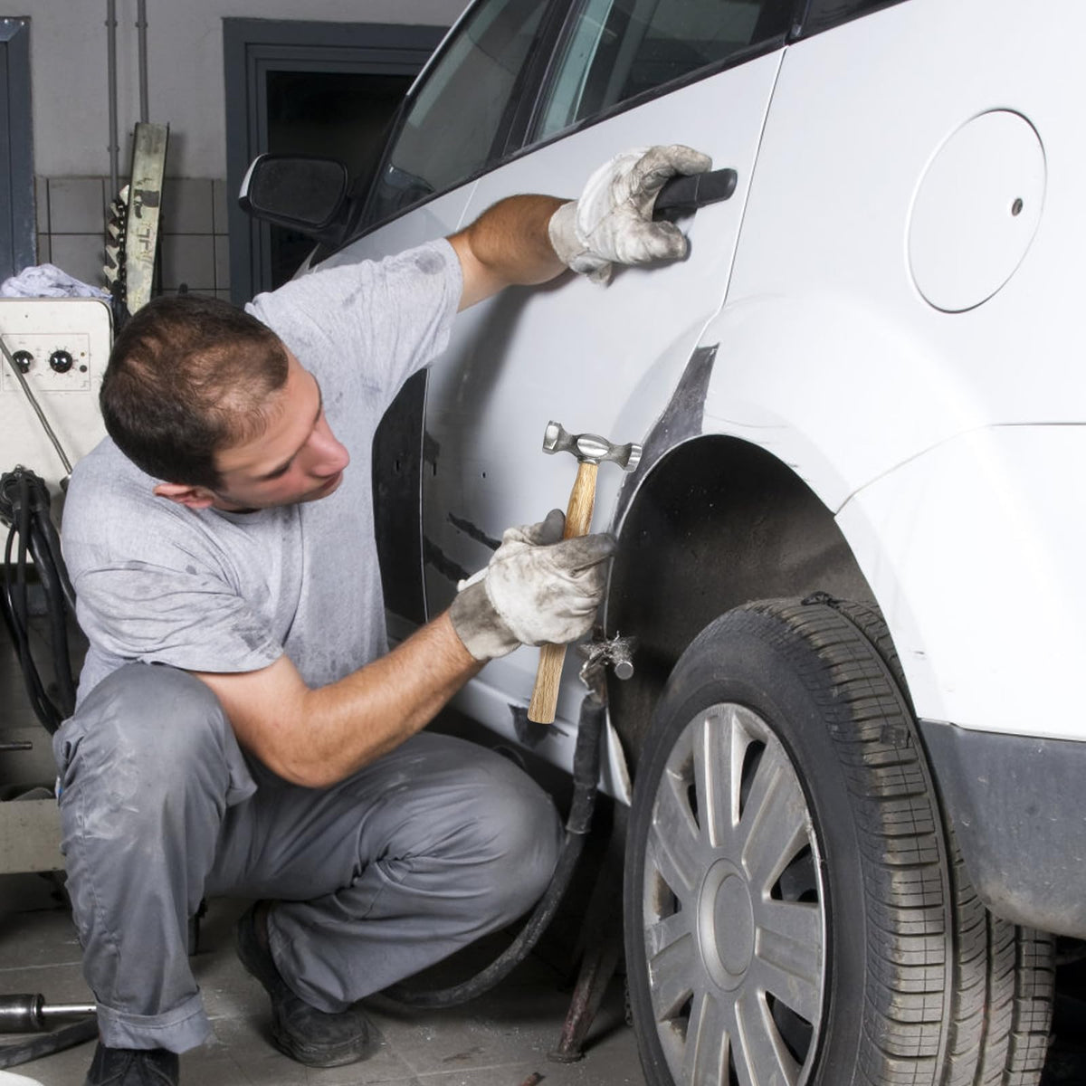 Hiceeden tools in use on car panel demonstrating precise dent removal