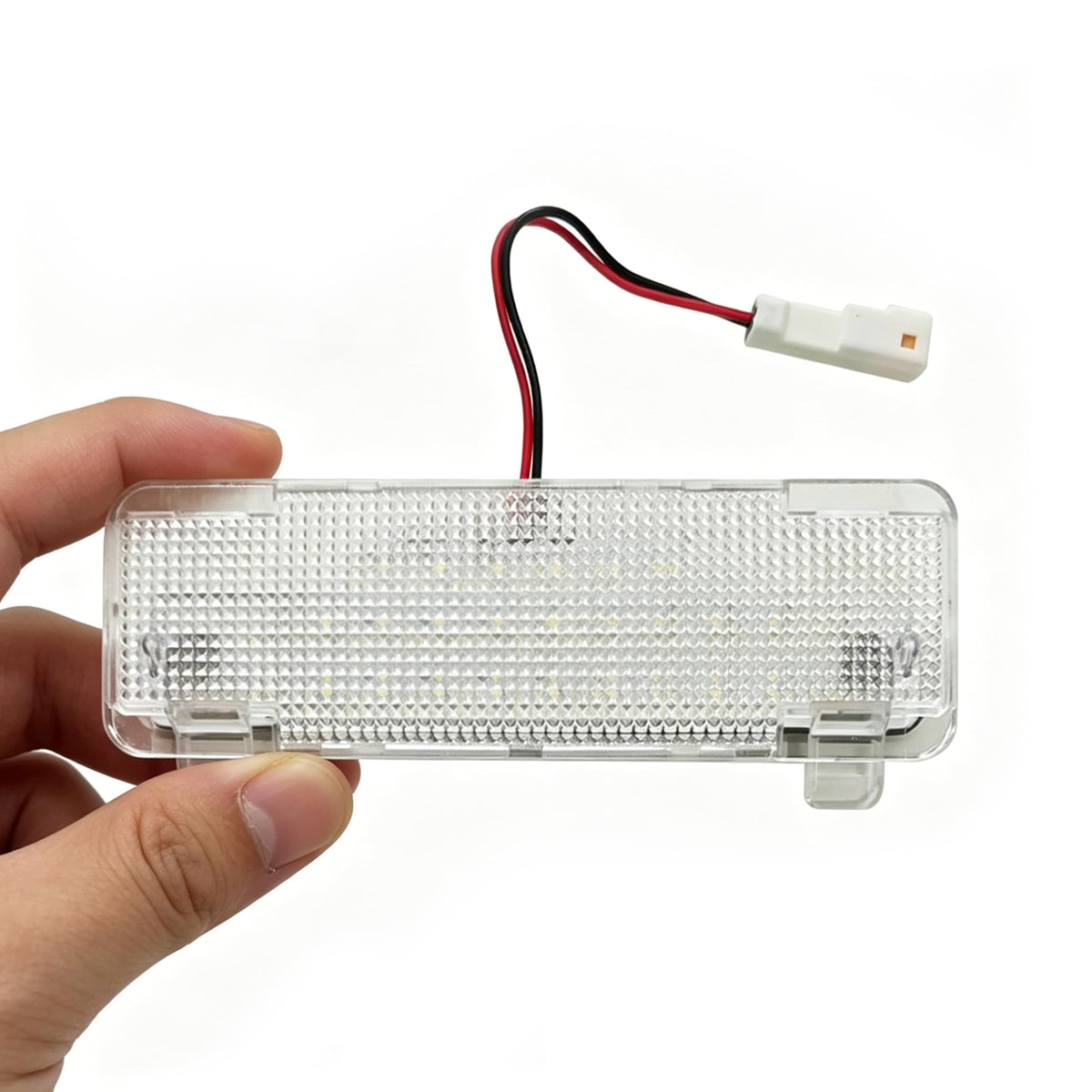 HIGH FLYING package contents laid out: LED light, pry tool, and wiring harness for quick install