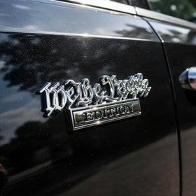 HJKK emblem on truck driving scene showing weatherproof hold and road-ready look