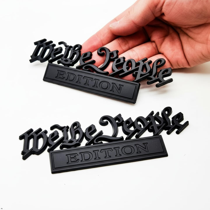 HJKK emblem front view showing matte-black patriotic badge and premium look