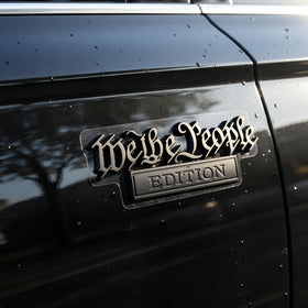 HJKK lifestyle shot on truck driving displaying durable, weatherproof finish