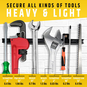 HMmagnets mounted on pegboard organizing workshop tools efficiently
