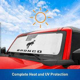 Holda sunshade beside steering wheel showing scale and precise windshield fit