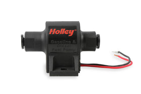 Holley 12-427 beside ruler showing compact size for flexible mounting options