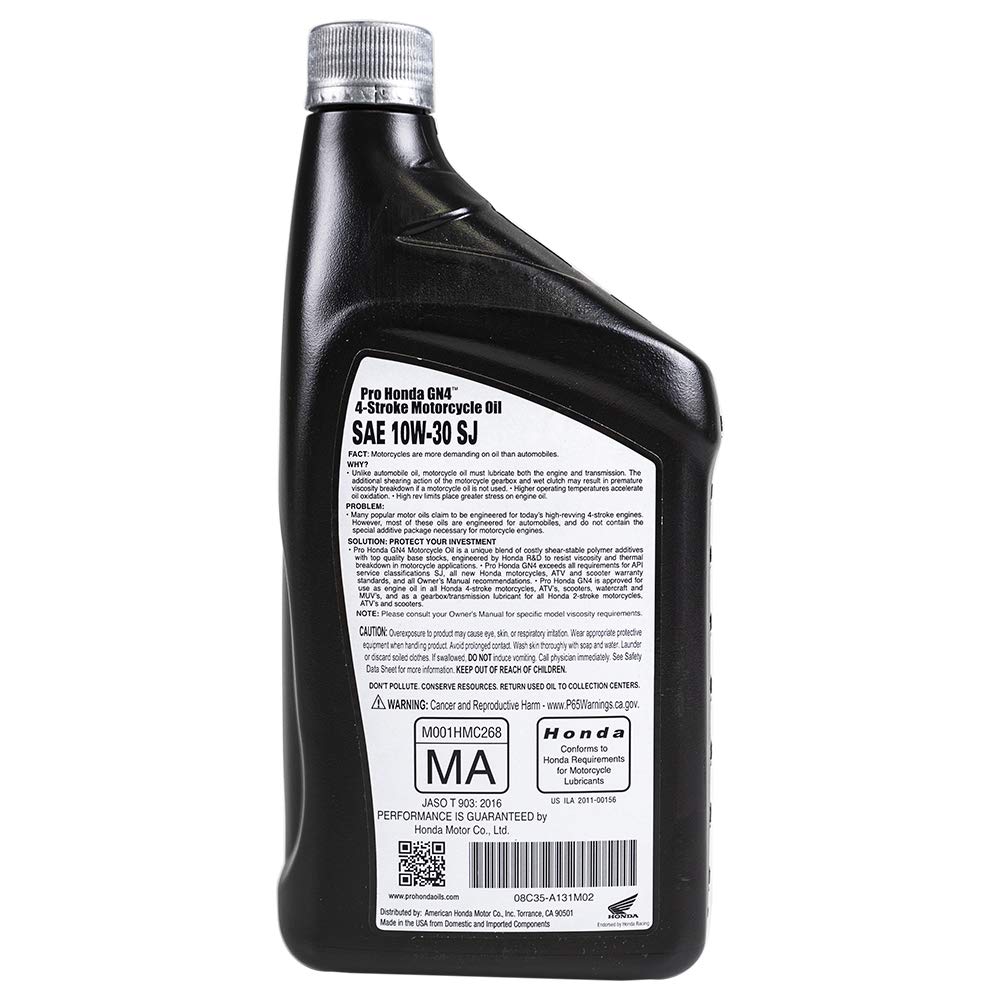 Pouring Honda GN4 10W-30 from one-quart bottle into engine, demonstrating easy, precise refill
