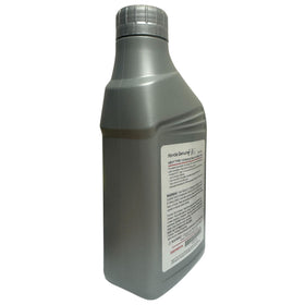 Pouring Honda HEVF fluid into a funnel during service for accurate filling benefit