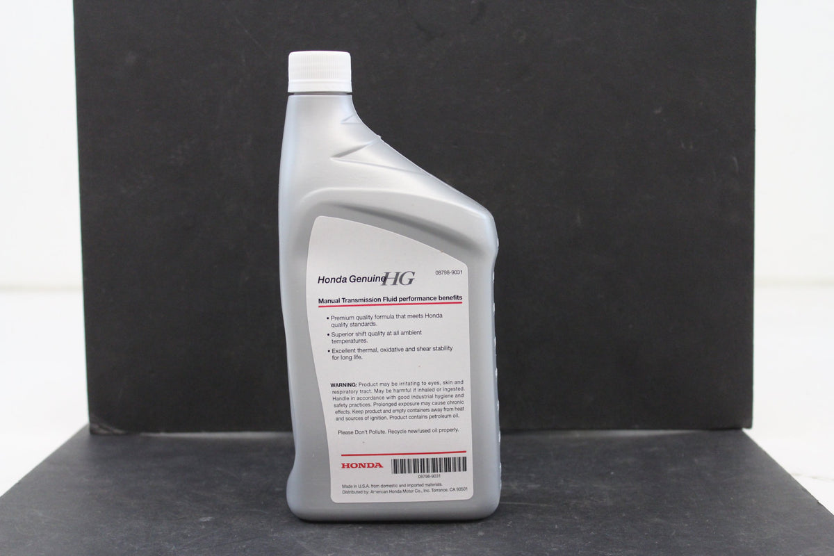 Honda manual transmission fluid pouring into transmission pan illustrating clean top-up benefit
