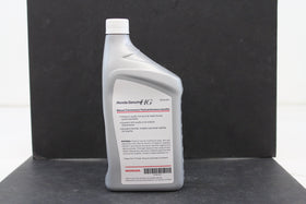 Honda manual transmission fluid pouring into transmission pan illustrating clean top-up benefit
