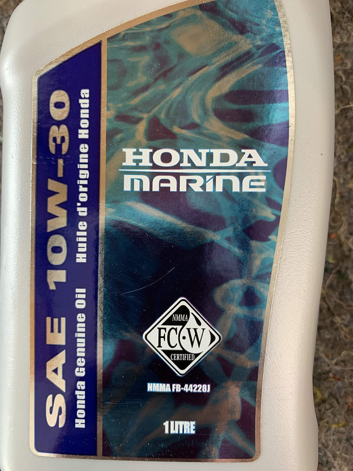 Honda marine oil on a boat deck during maintenance illustrating OEM protection benefit