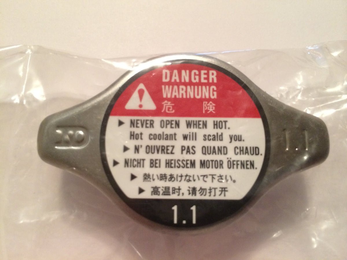 Honda radiator cap installed on filler neck displaying correct engagement benefit